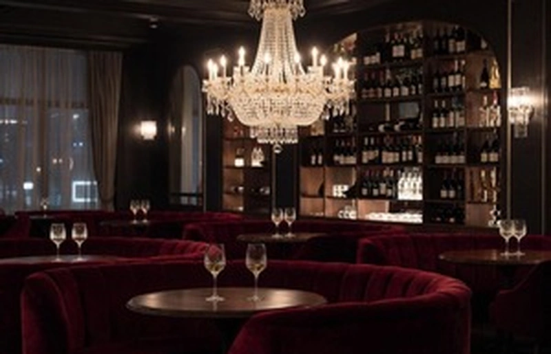 Private wine lounge illustrating respectful financial submission boundaries
