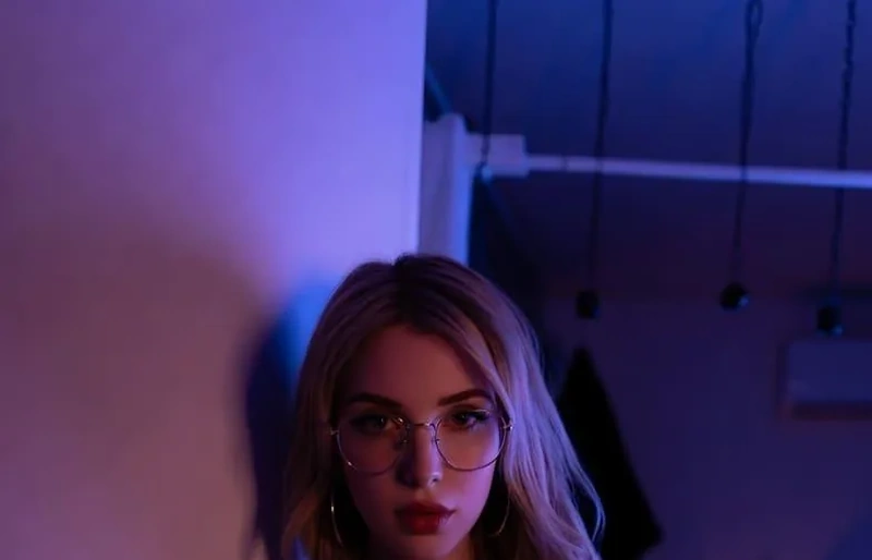 Woman in moody lighting for the safe findom budget guide